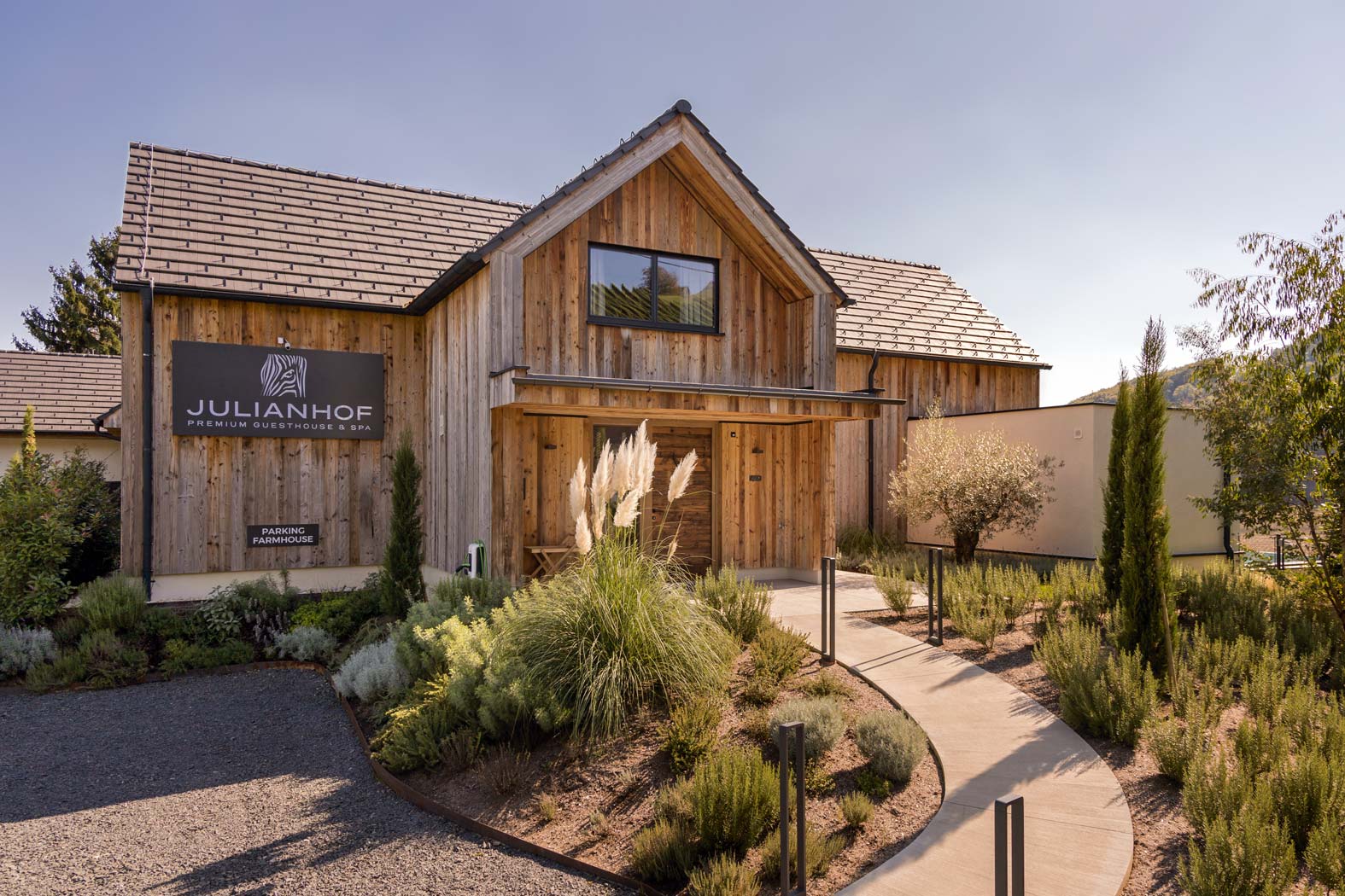 Käfer Bau Baufirma Baumeister Bauunternehmen Bauplanung Straden Südoststeiermark Steiermark gartenanlage zierkieswege gartenmauer steinmauer gartenhaus sichtschutz windschutz regenwasser-zisterne